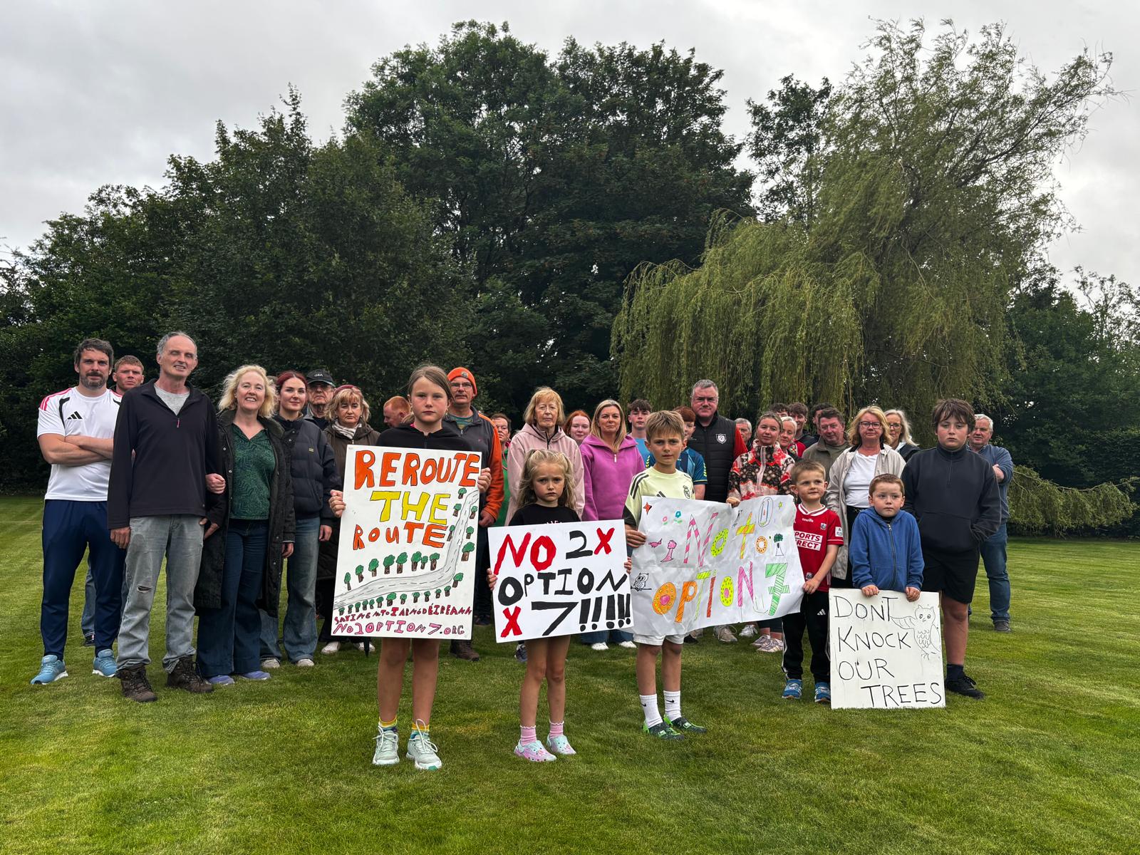 Large group of residents with handmade signs